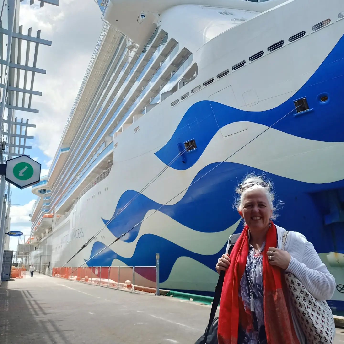 Jo standing on the dock in front of the ship